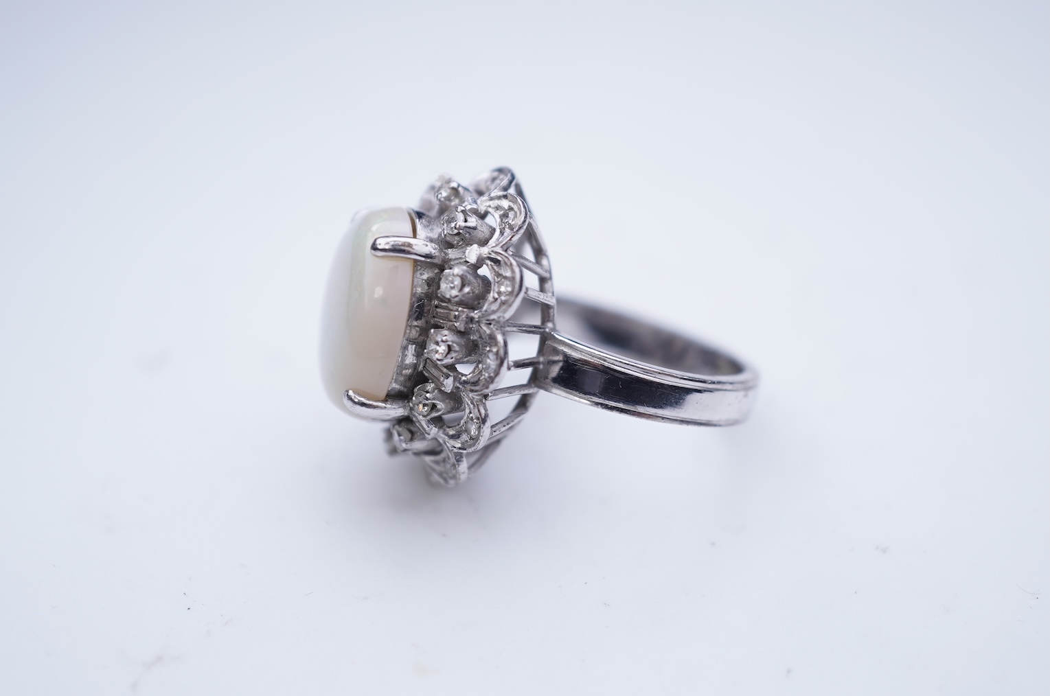 An opal and diamond cluster ring